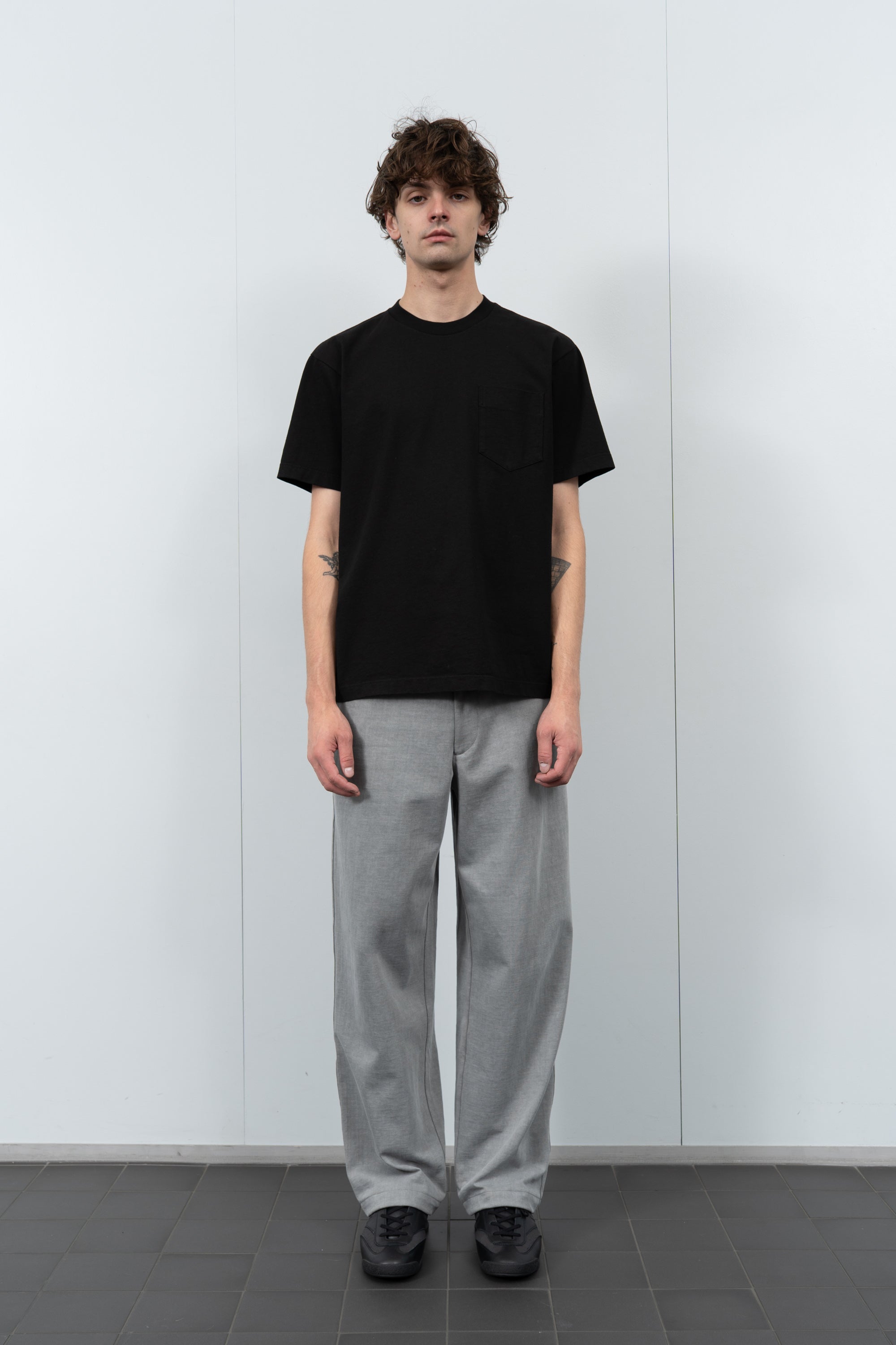 Model poses in LW103 Municipal Pocket T-shirt in black