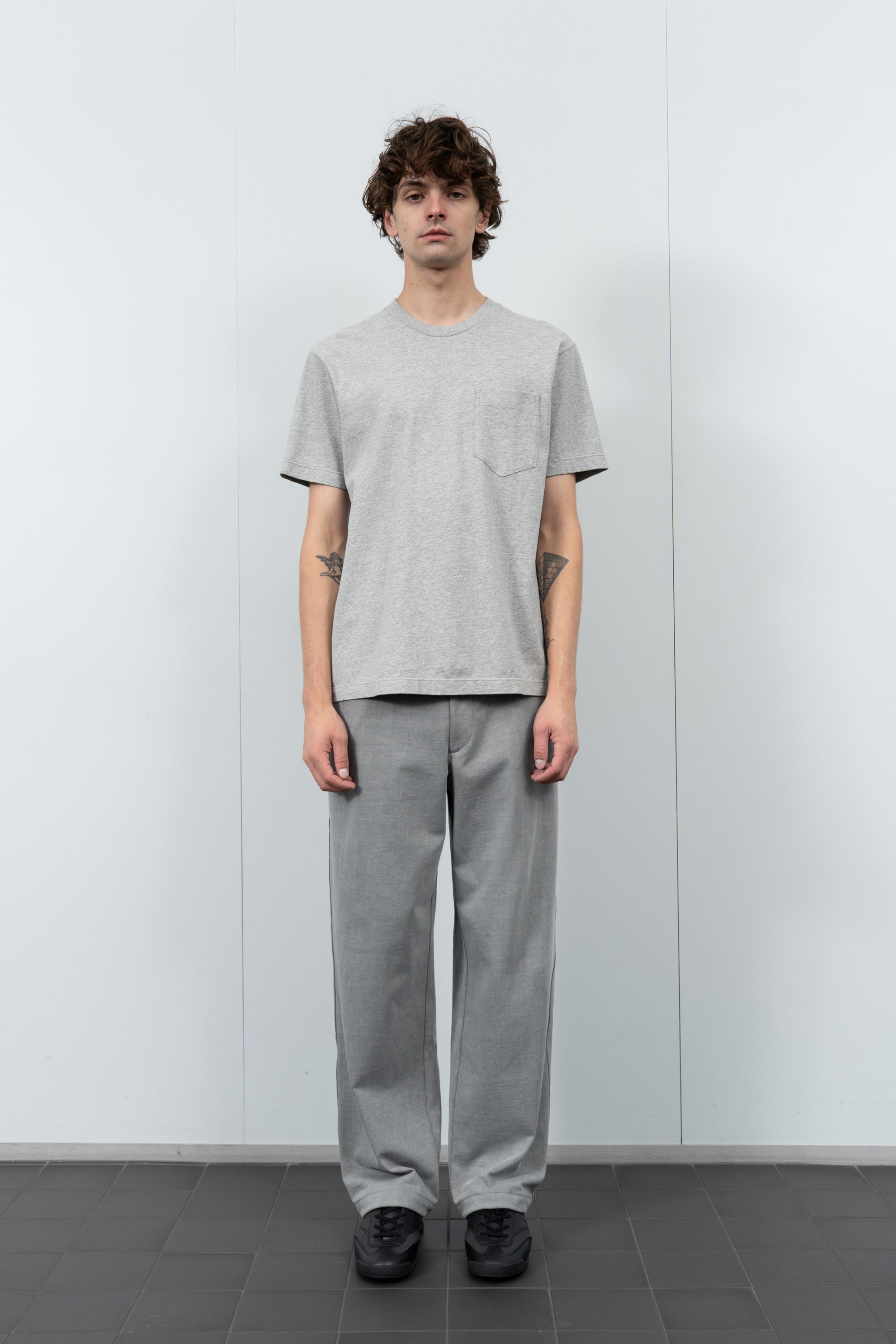 Model poses in LW103 Municipal Pocket T-shirt in heather gray