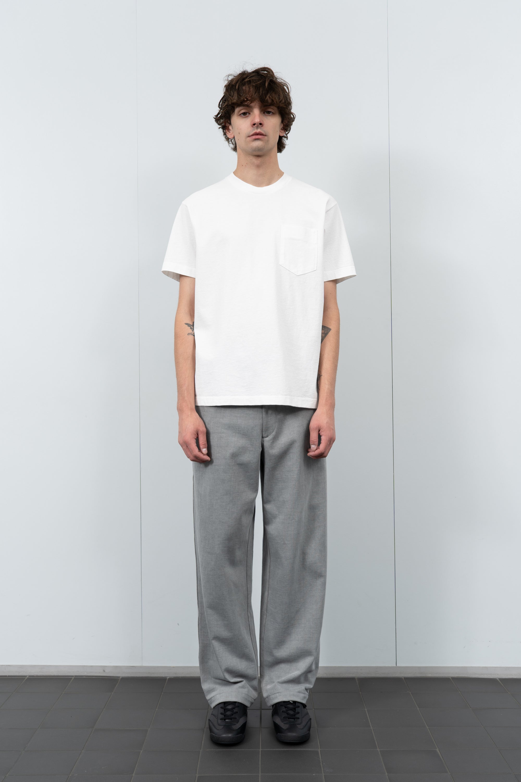 Model poses in LW103 Municipal Pocket T-shirt in white