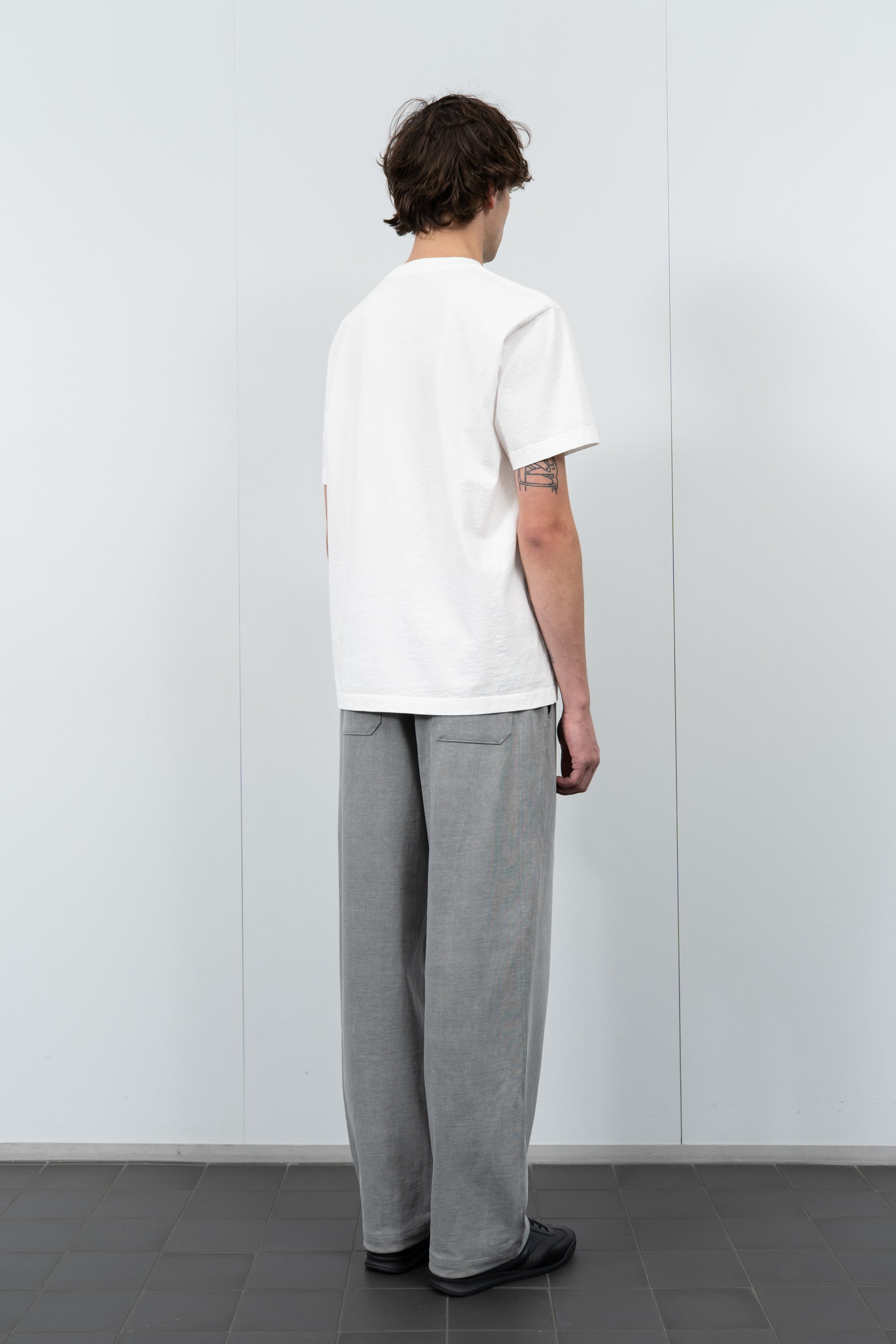 Model poses in LW103 Municipal Pocket T-shirt in white