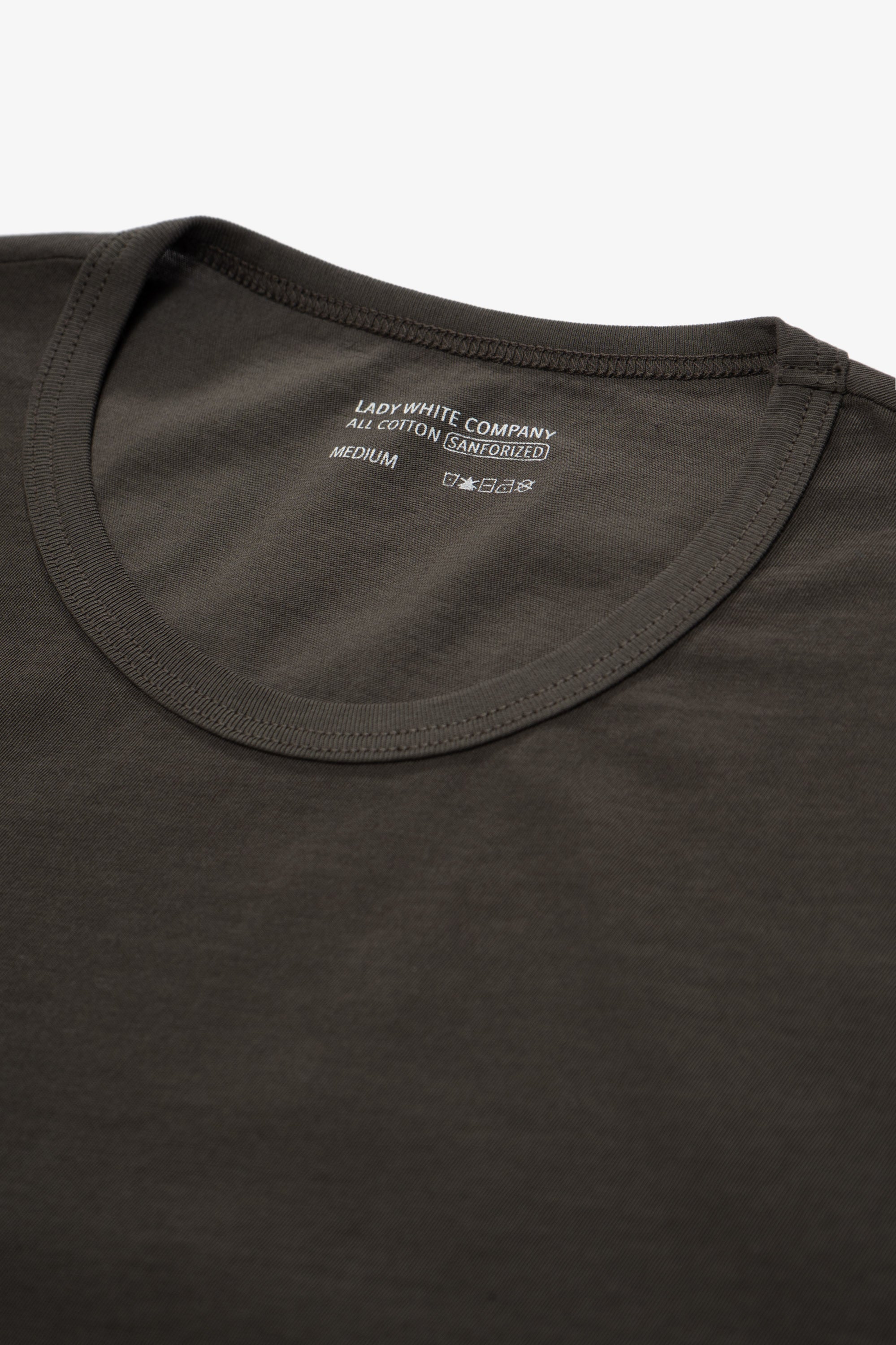 Collar detail of of the LW110 Dry-lite T-shirt in a greenish black, “Black Pine”