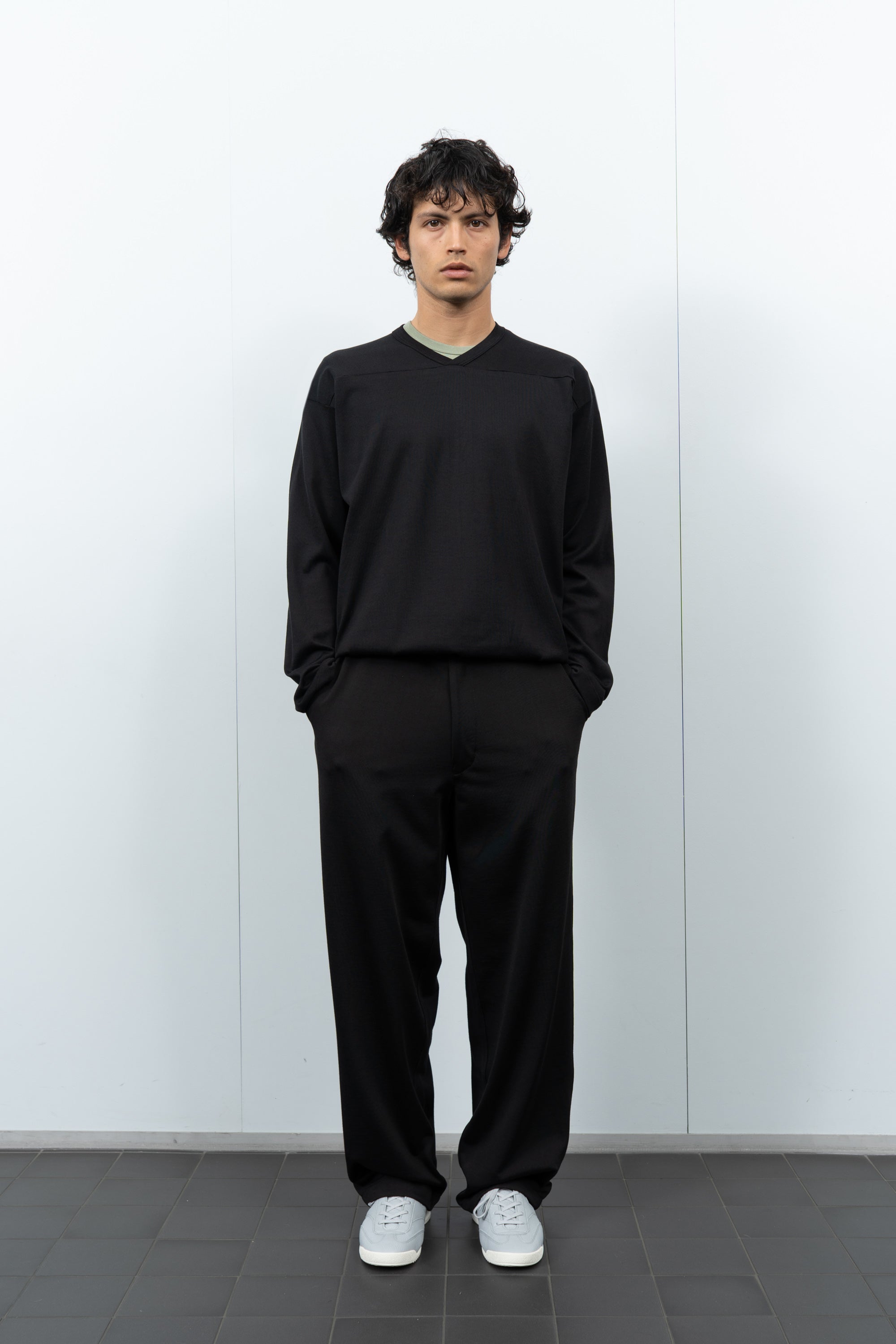 Front-facing on-model photograph of model wearing LW135 LS Football T-shirt in Black