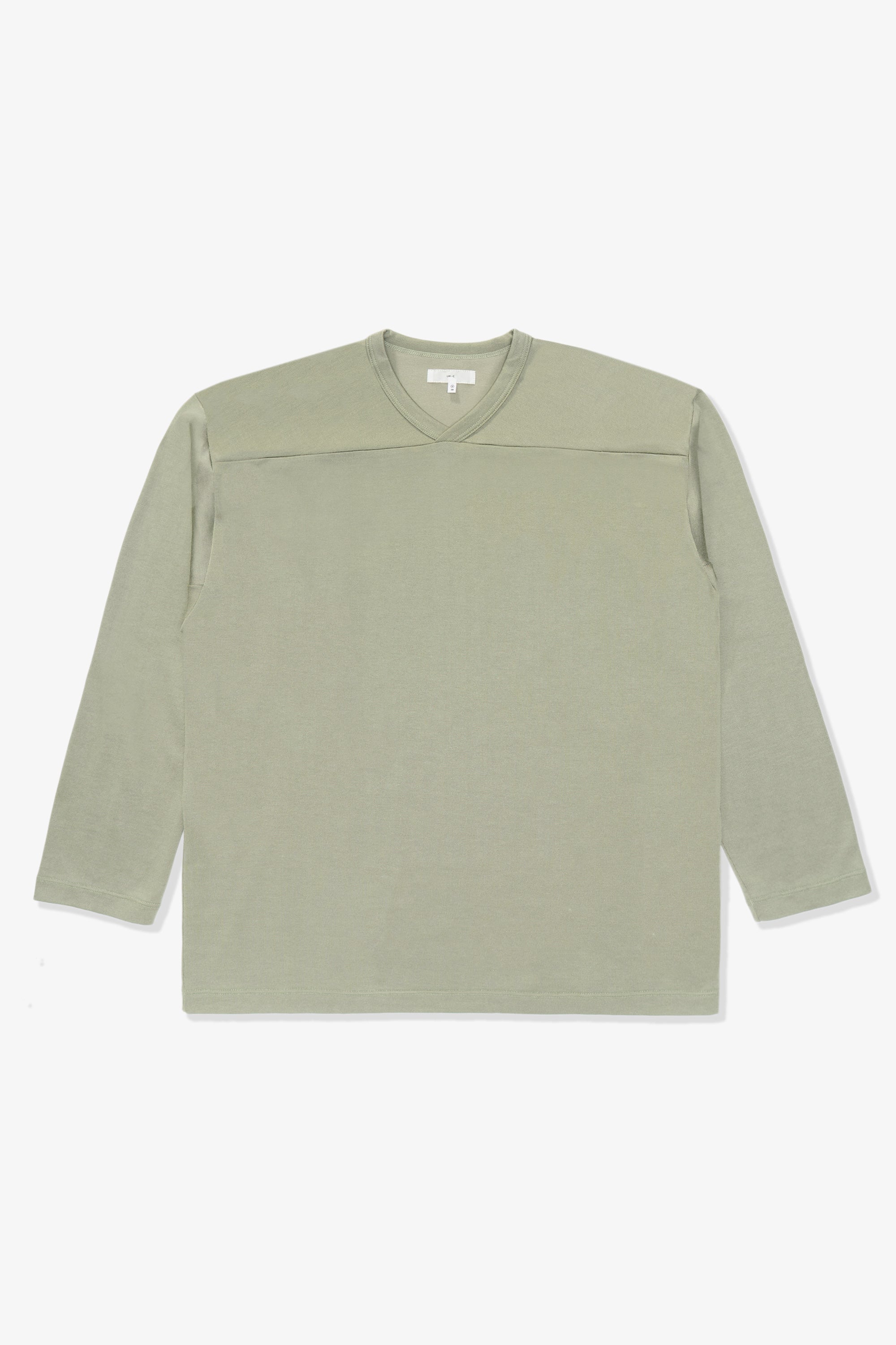 Full length flat-lay photograph of the LW135 LS Football T-shirt in a flat, pastel green, “Pistachio”