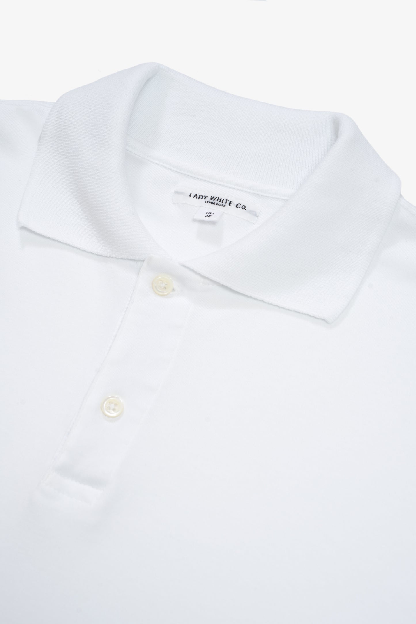 INTERLOCK TWO BUTTON POLO - WHITE