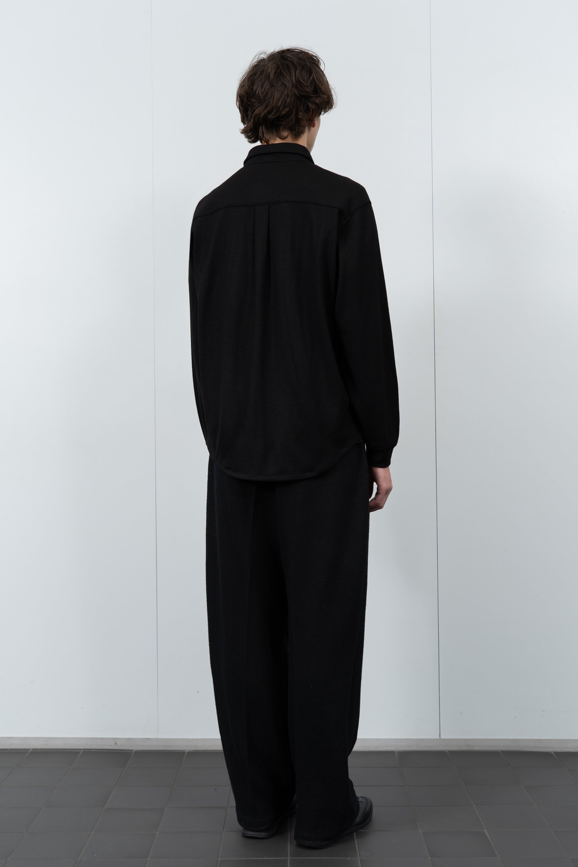 Model poses in LW444W Wool Button up  in black