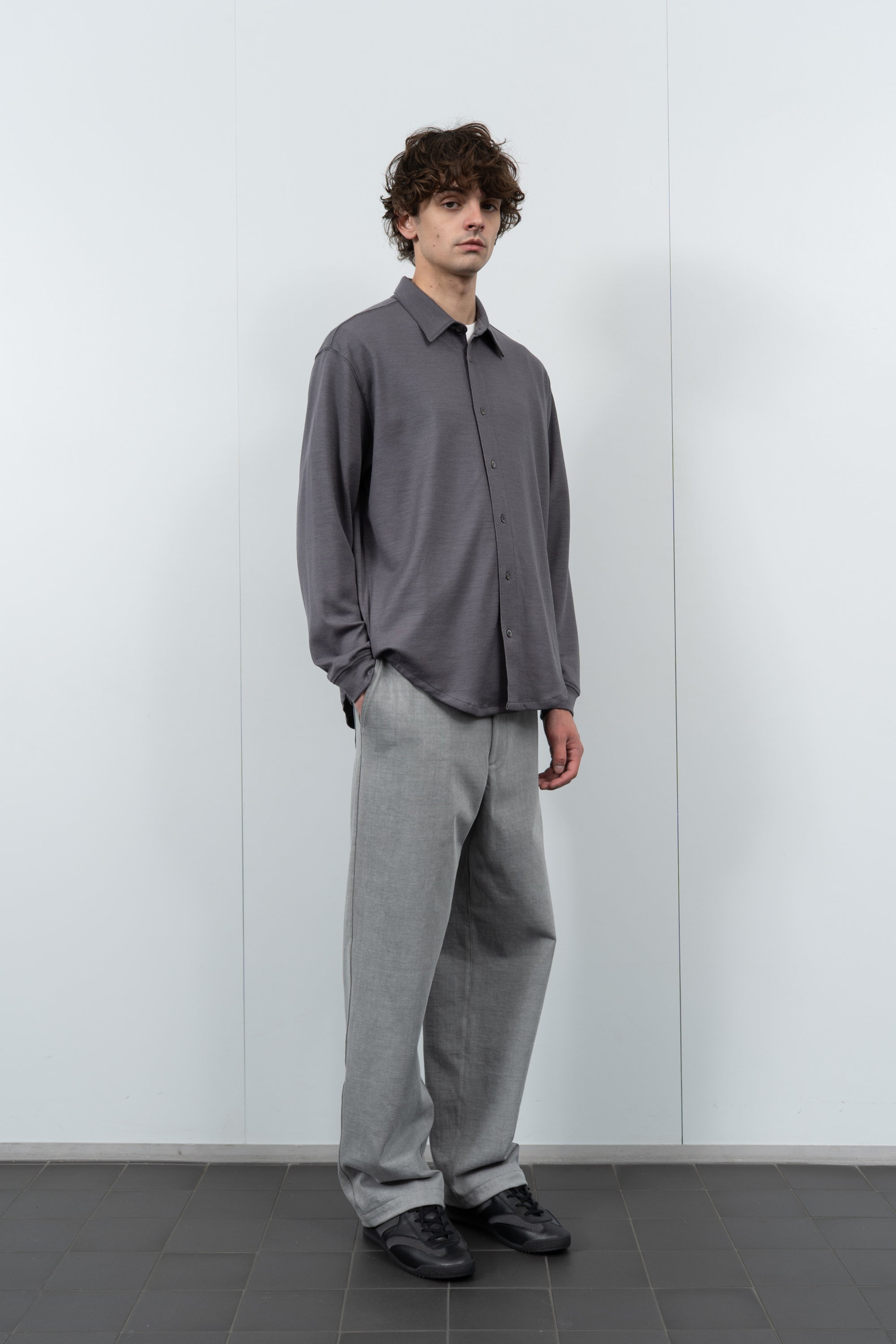 Model poses in LW444W Wool Button up  in slate grey