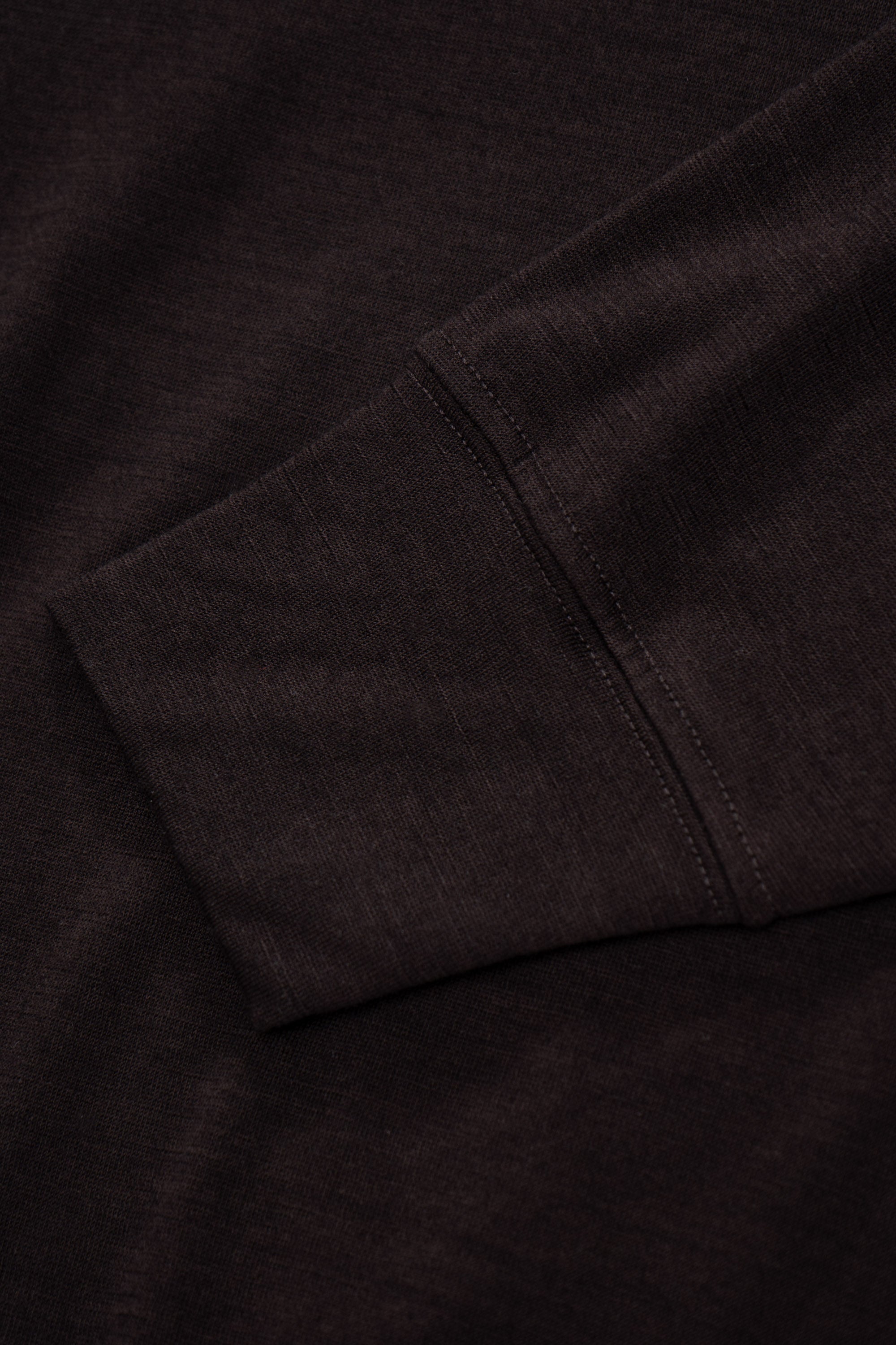 Close-up of cuff of LW601W Wool Jersey Sweater in woodberry 