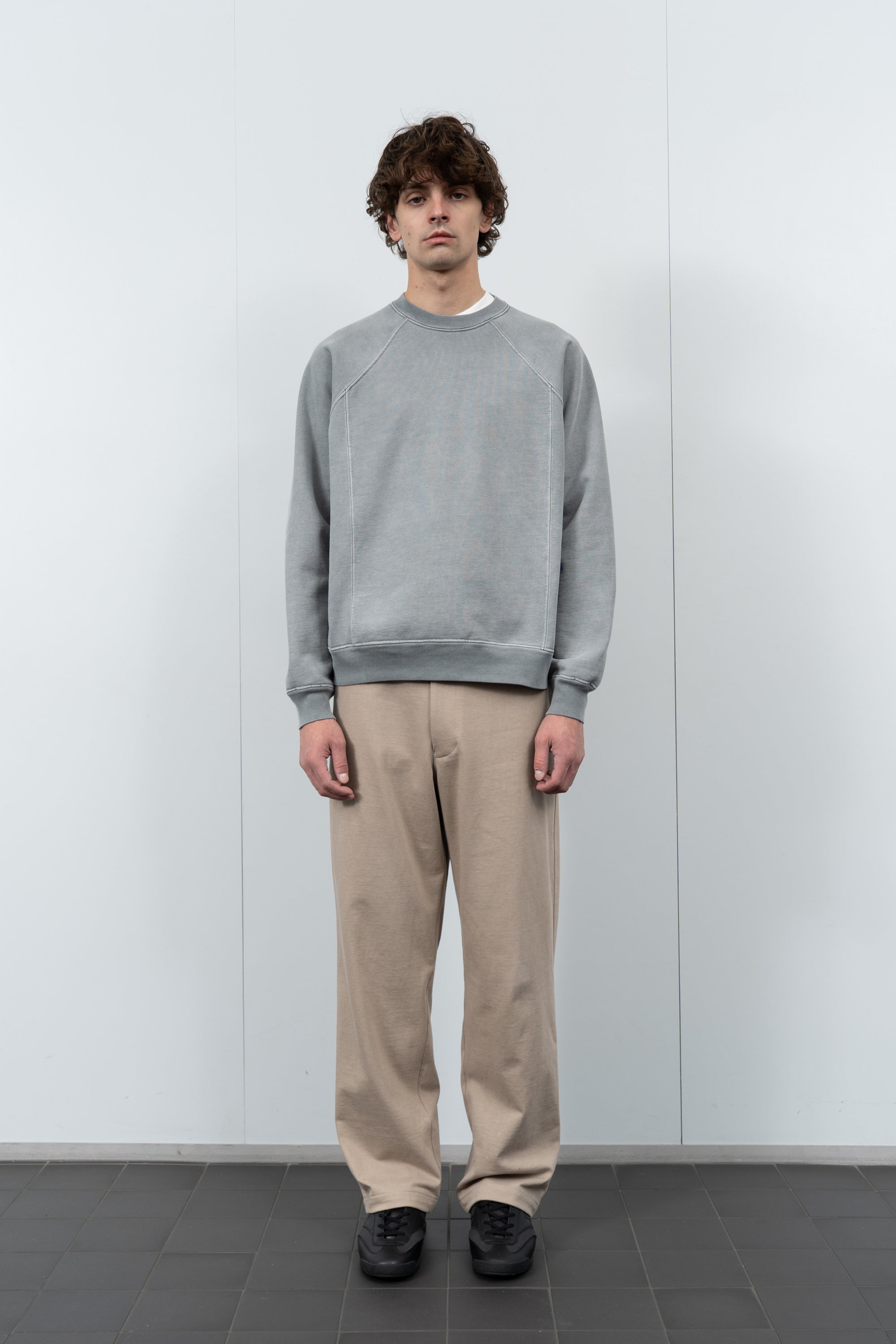 Model poses in LW620 Heavy Gusset Crewneck in pigment kelp