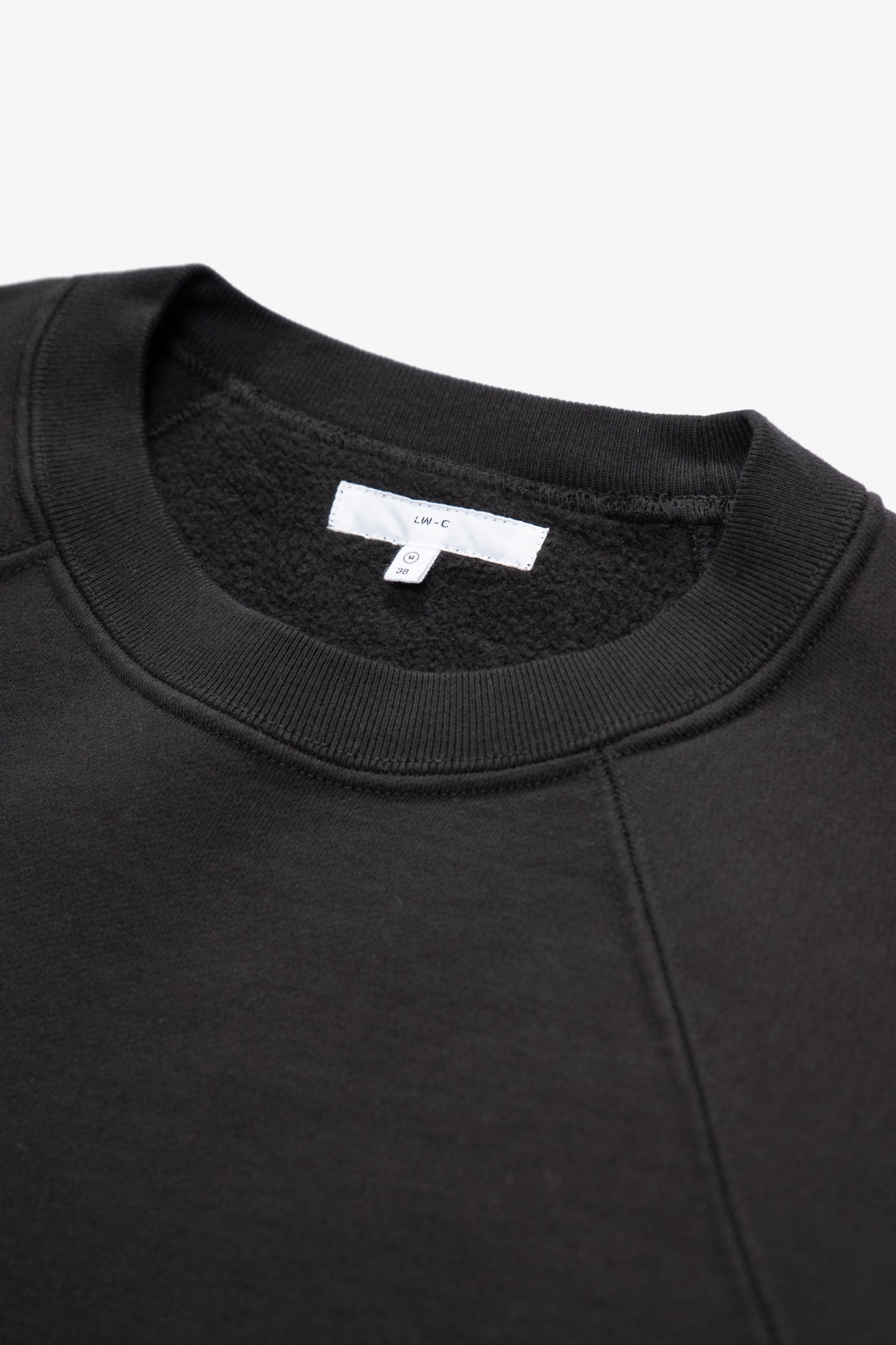 Close-up of collar of LW620 Heavy Gusset Crewneck in shadow