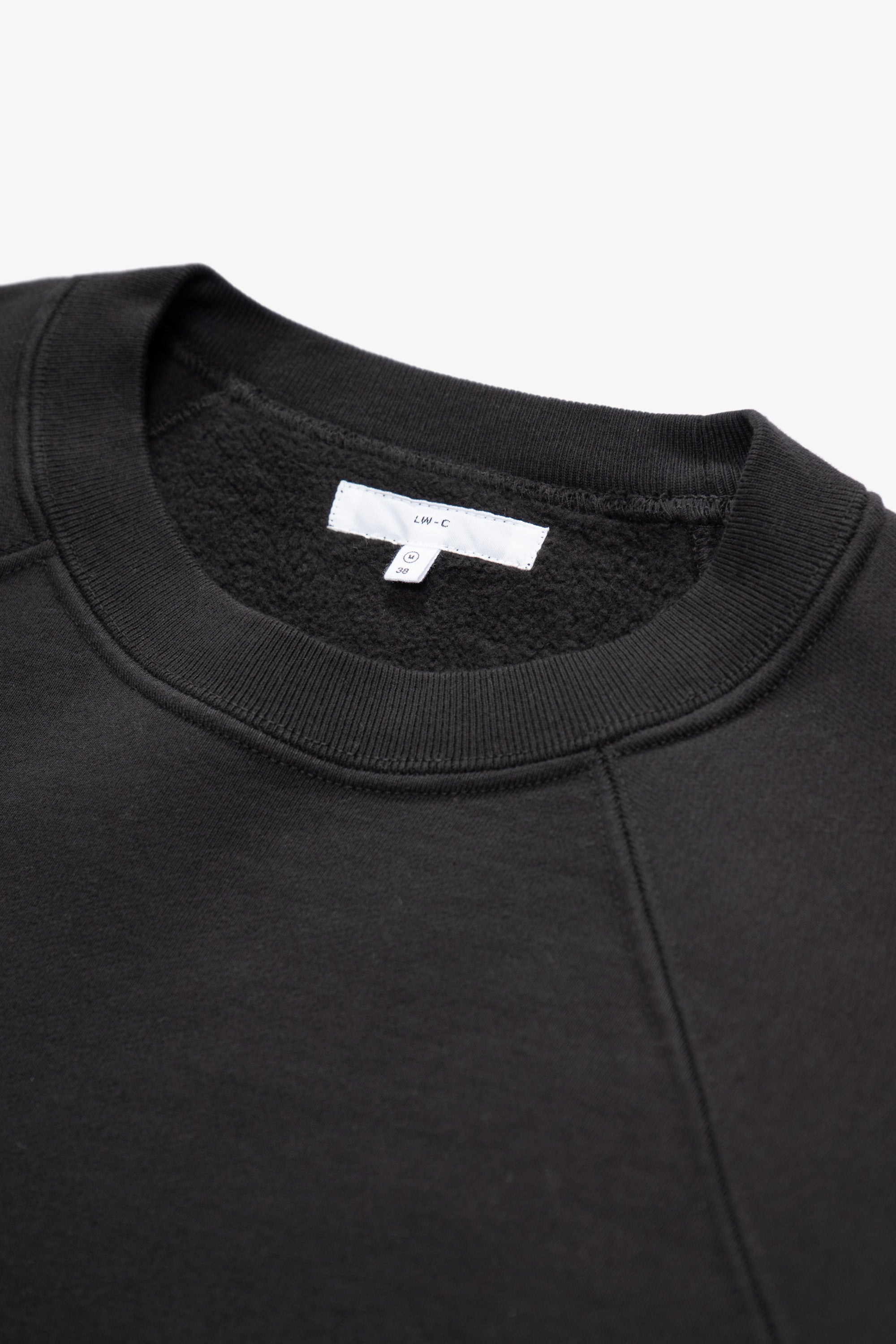 Close-up of collar of LW620 Heavy Gusset Crewneck in shadow
