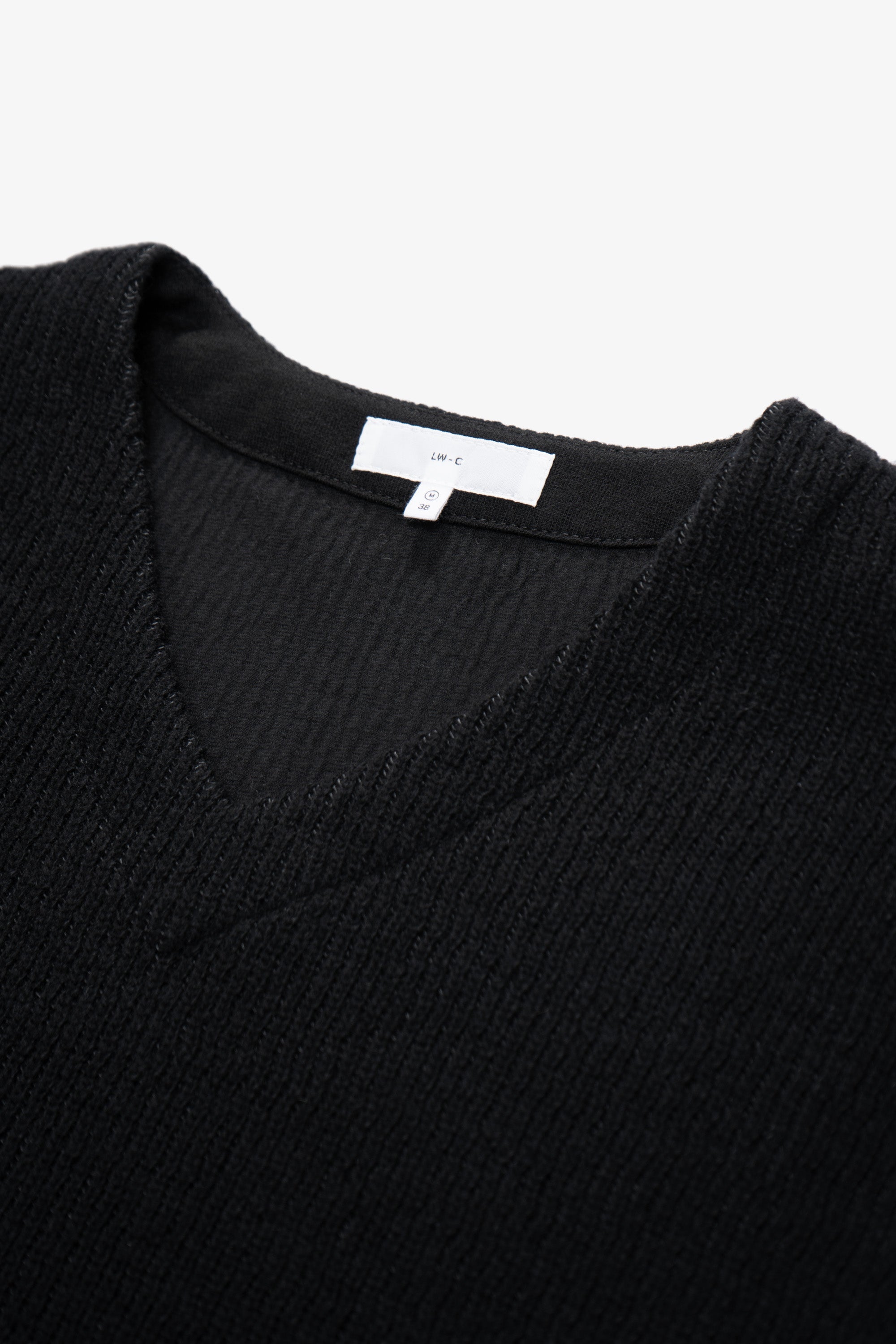 Close-up of collar of LW770CW V Neck Snap Sweater in black