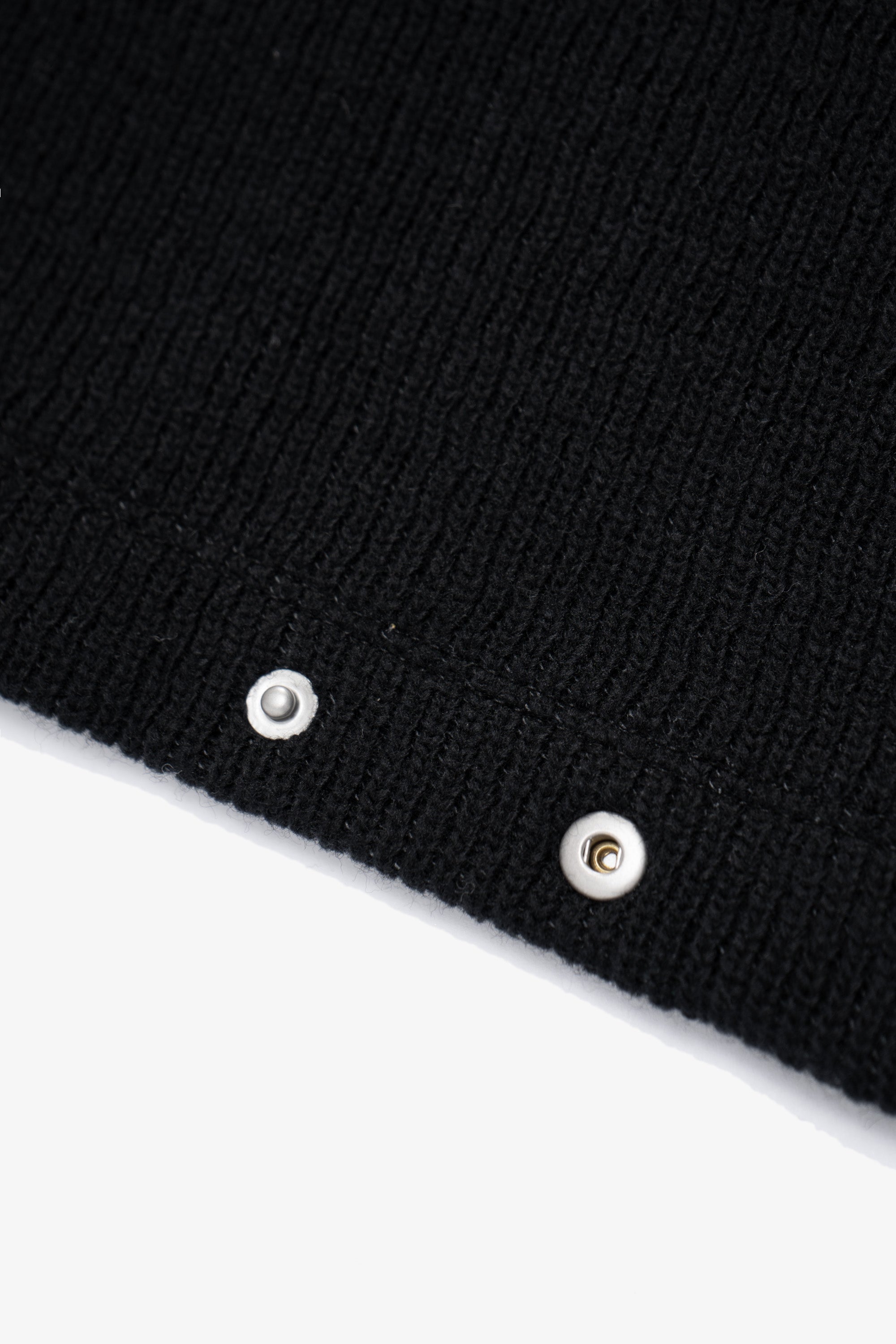Close-up of cuff of LW770CW V Neck Snap Sweater in black, snaps on cuff