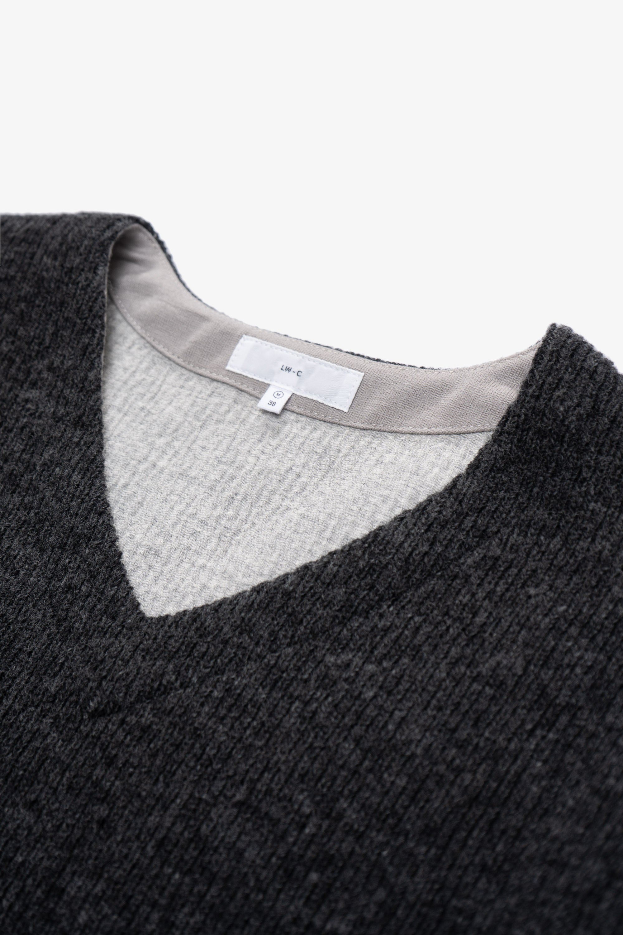 Close-up of collar of LW770CW V Neck Snap Sweater in charcoal