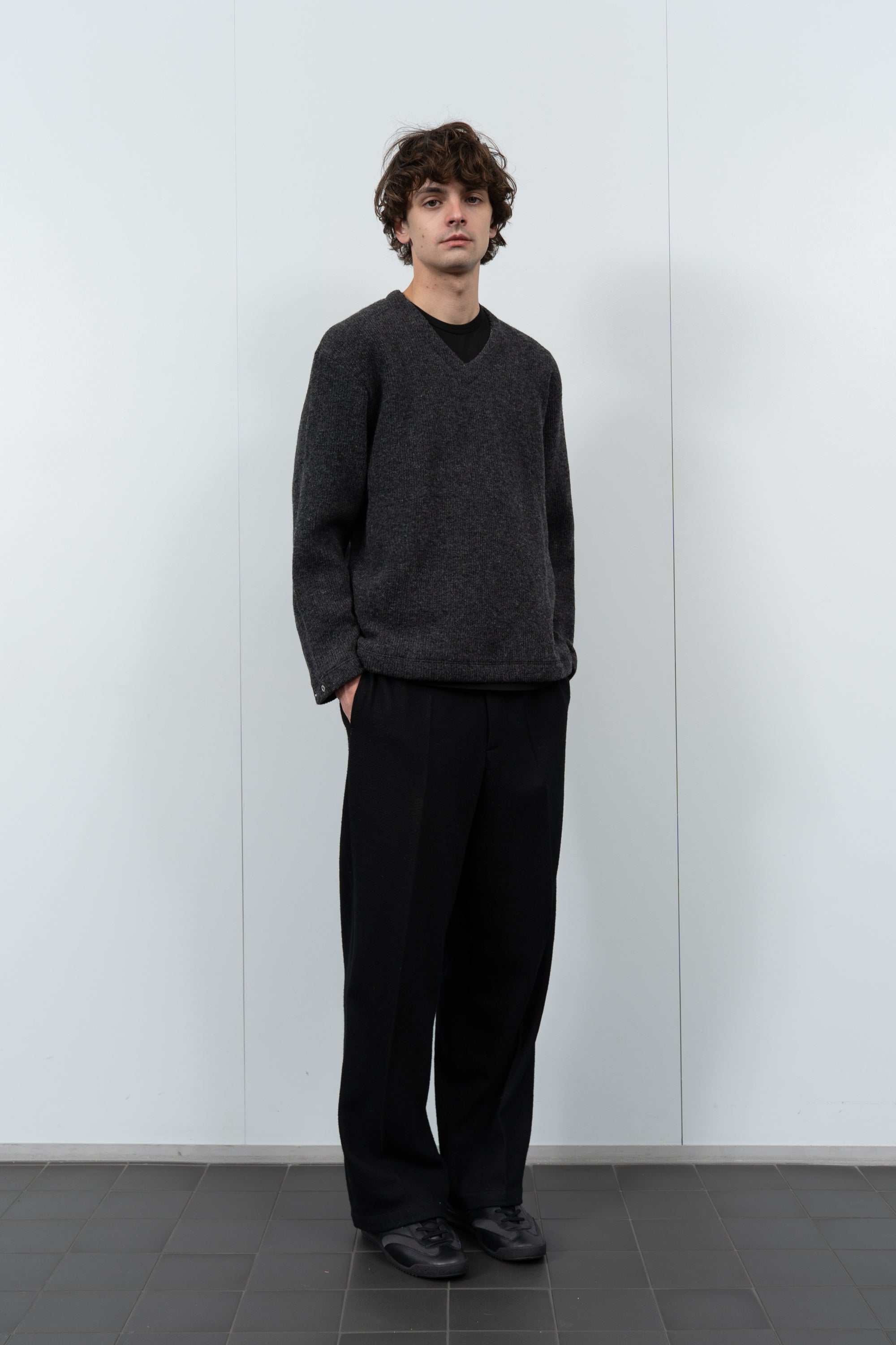 Model poses in LW770CW V Neck Snap Sweater in charcoal