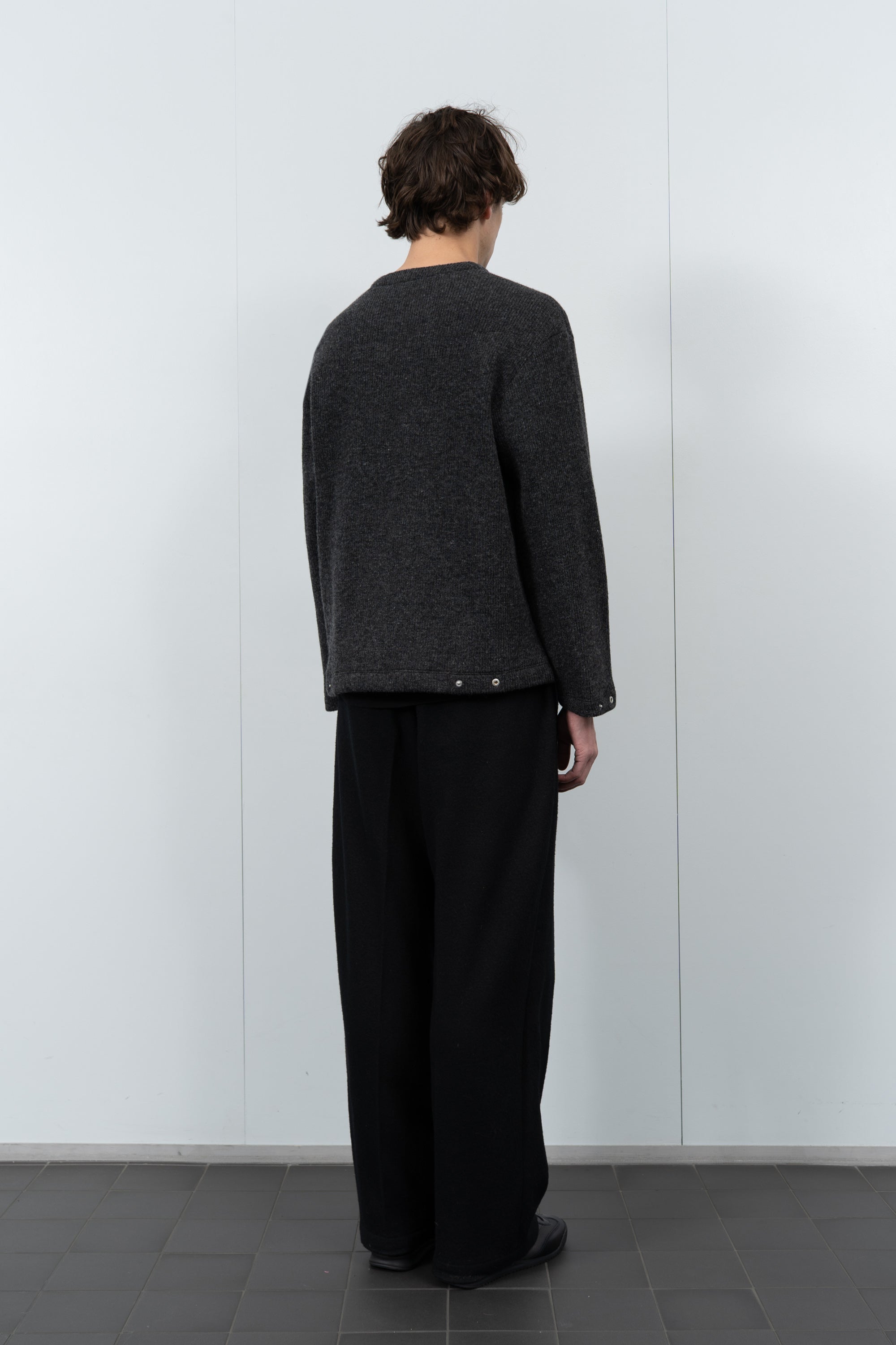 Model poses in LW770CW V Neck Snap Sweater in charcoal