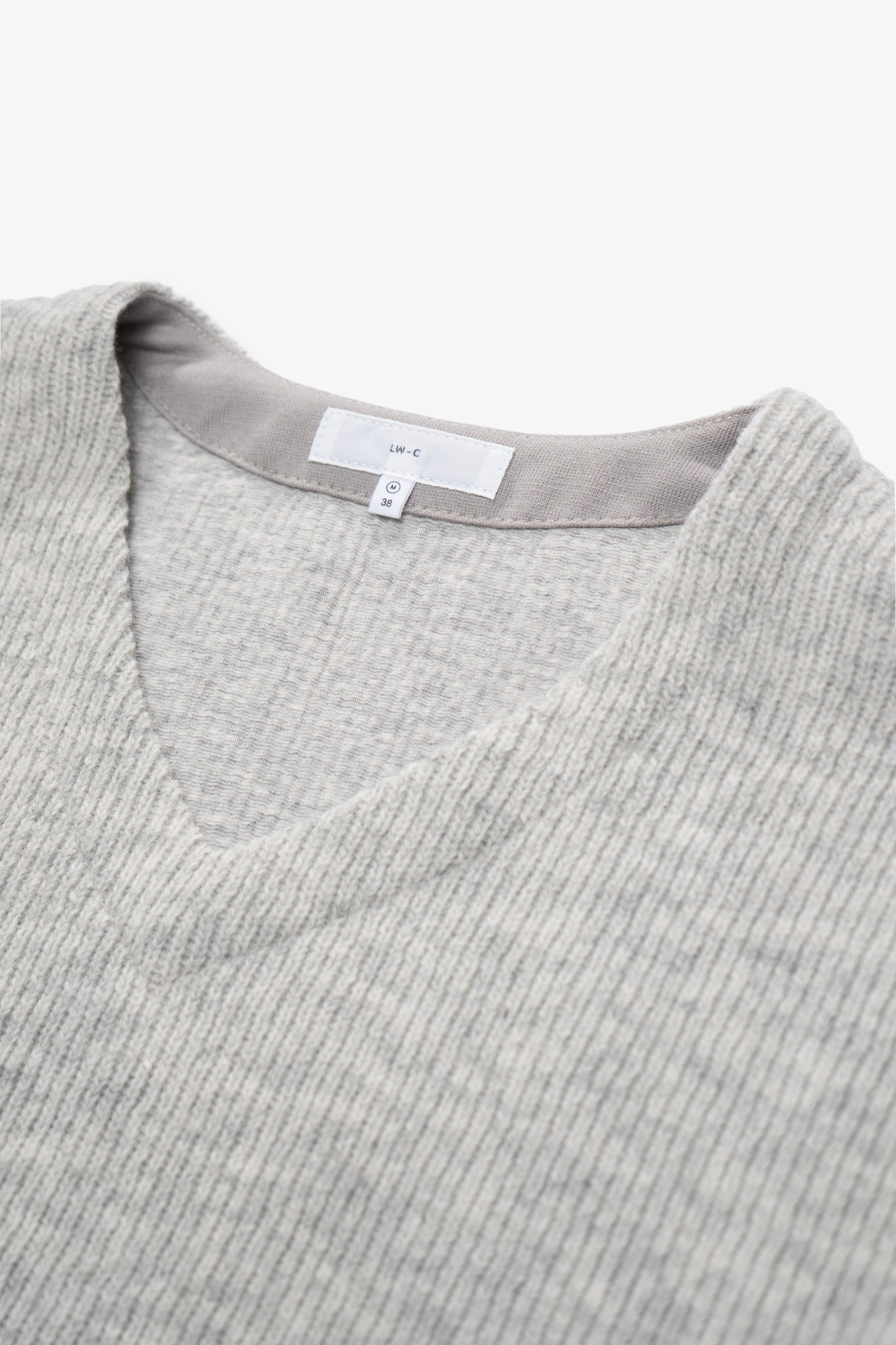 Close-up of collar of LW770CW V Neck Snap Sweater in oatmeal
