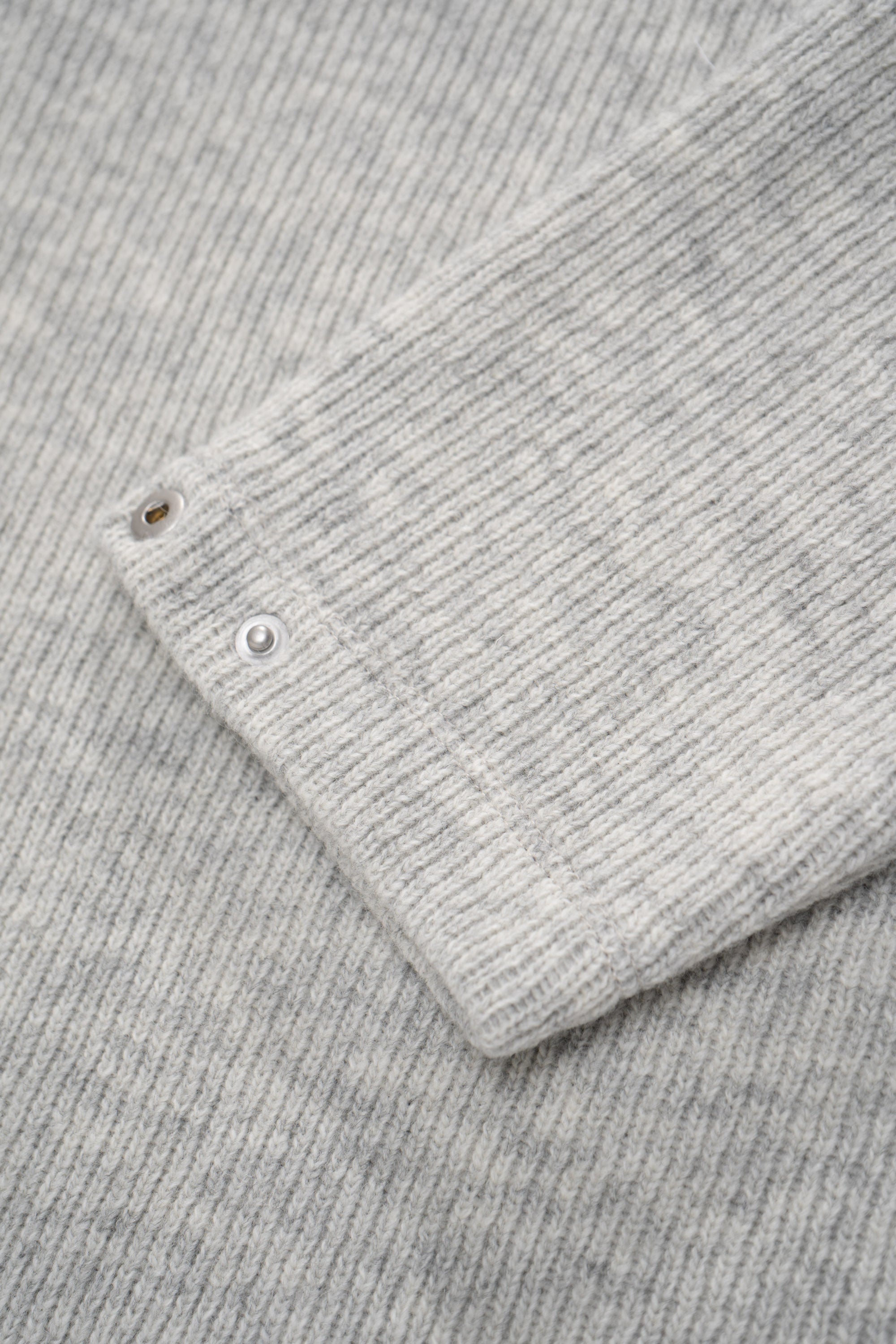Close-up of cuff of LW770CW V Neck Snap Sweater in oatmeal, snaps on cuff