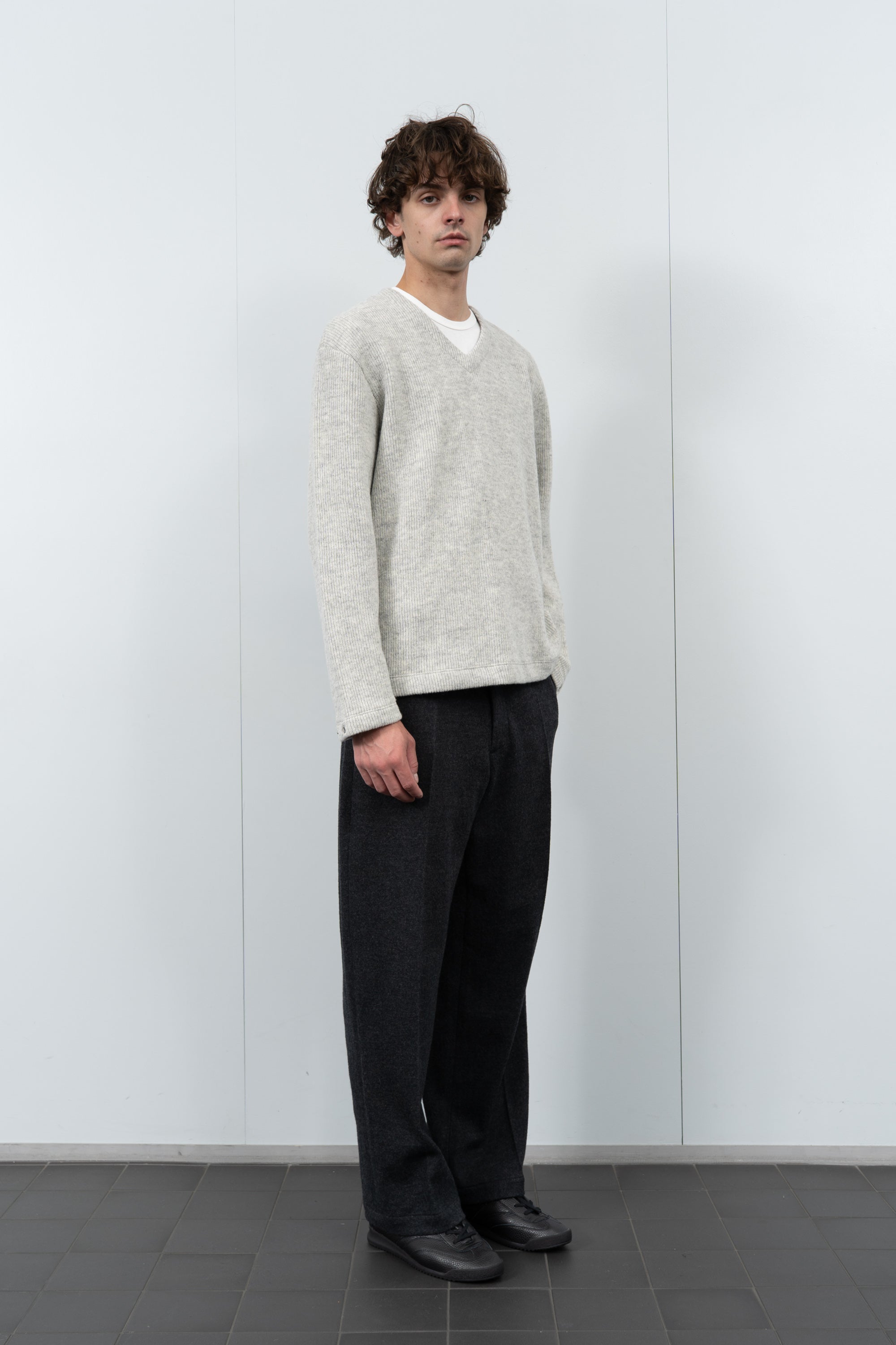 Model poses in LW770CW V Neck Snap Sweater in oatmeal