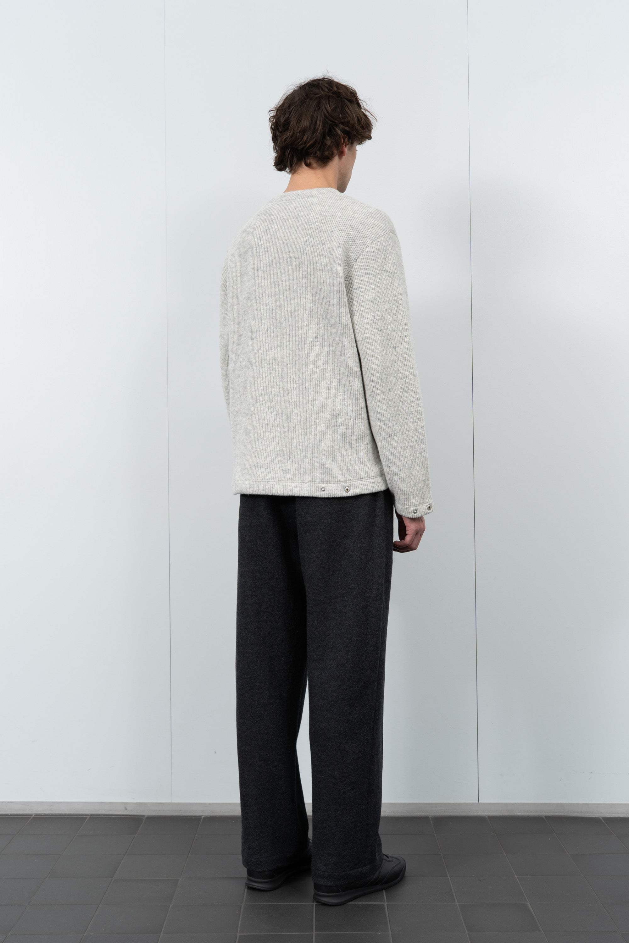 Model poses in LW770CW V Neck Snap Sweater in oatmeal