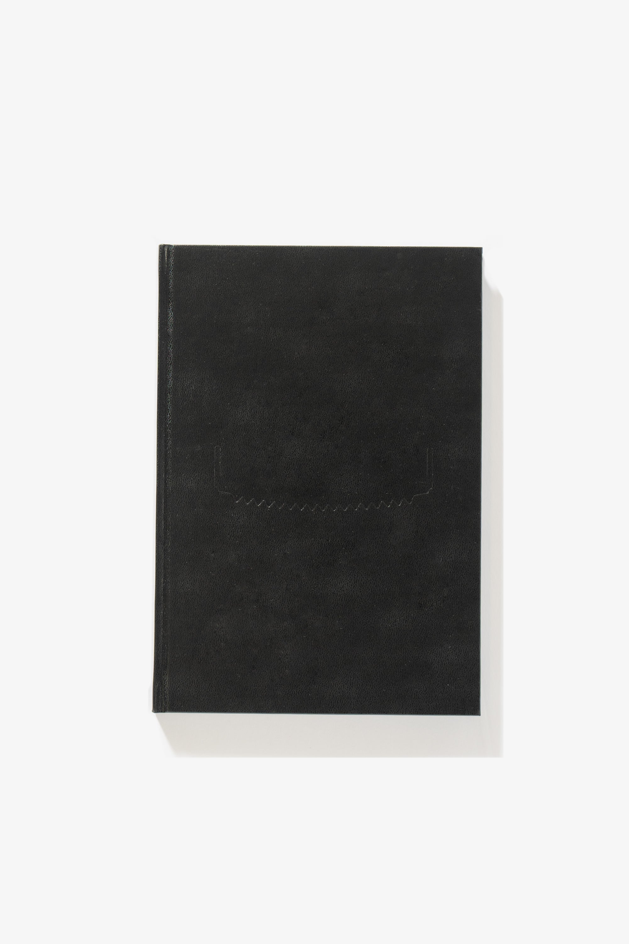 Full-length image of the cover of Rimaldas Viskratis’s photography book NAKED, a black cover with a debossed graphic. 