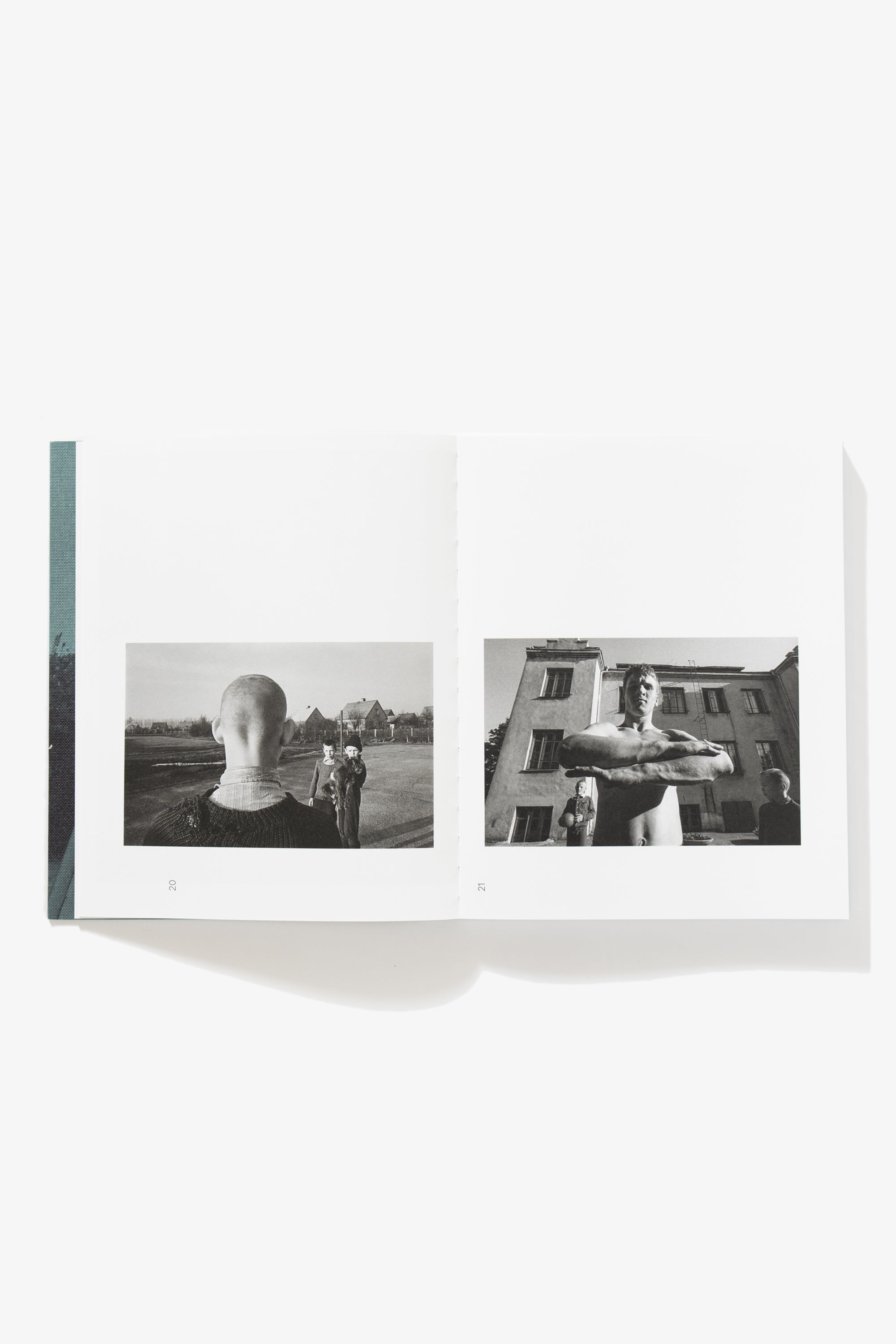 Spread of School is my Home. Verso shows a half-width photograph of the rear of a boy’s head. Recto depicts an image of a boy with his forearms stacked in front of his chest.